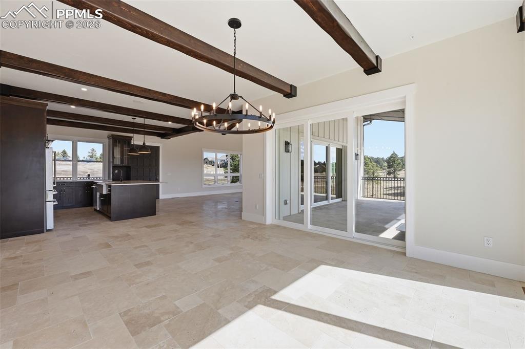 Image 10 of 45: Dining Room, looking into kitchen; patio to right.