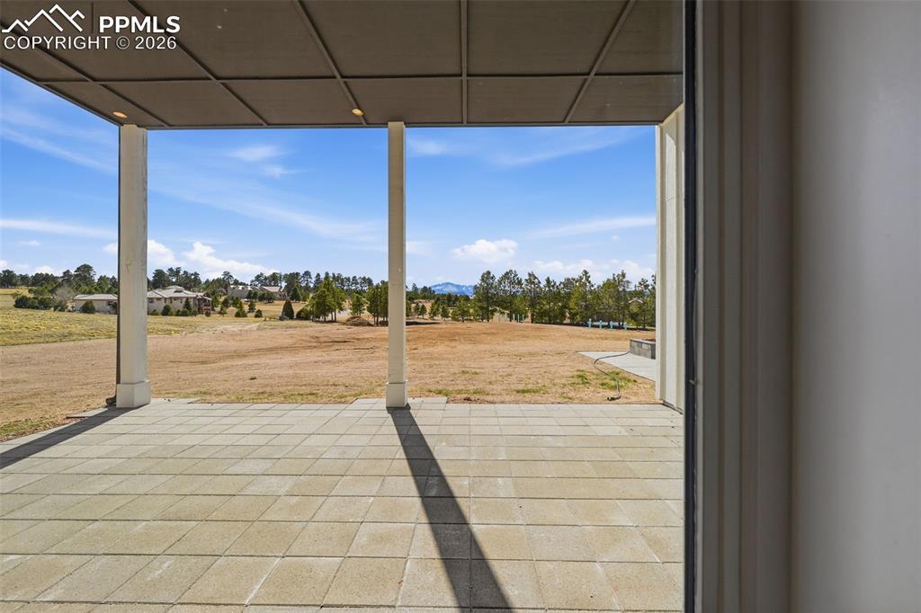 Image 28 of 45: View on patio from walk-out on Lower-Level Family Room