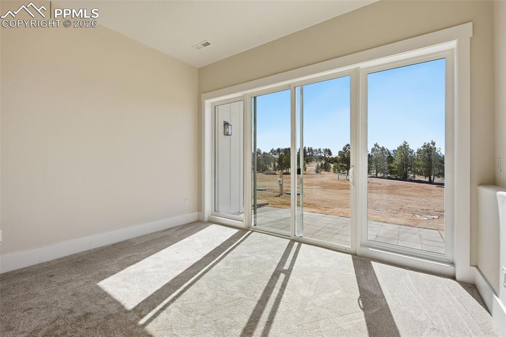 Image 34 of 45: Spare room featuring light carpet and baseboards