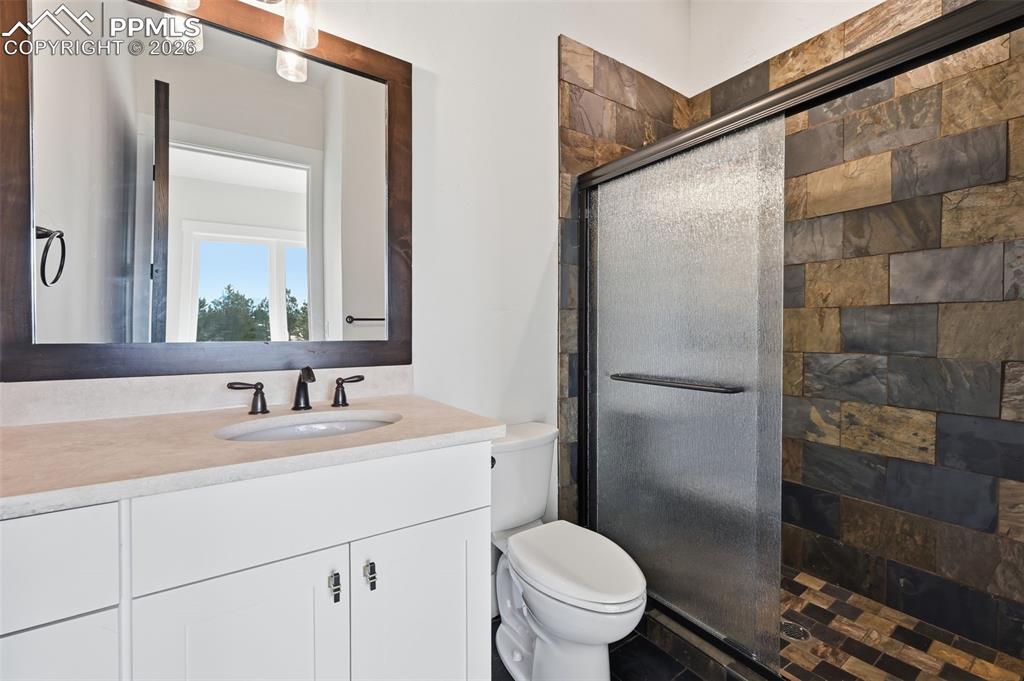 Image 35 of 45: 3-piece bathroom to 2nd bedroom on lower level.