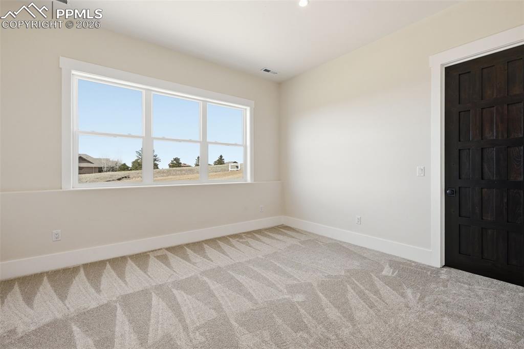 Image 36 of 45: 3rd Bedroom on lower north.  level -window faces 