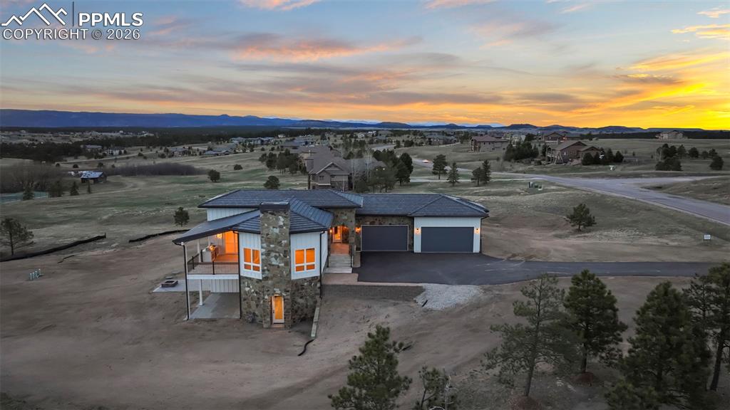 Image 41 of 45: Aerial view at dusk of a rural view and a mountain view