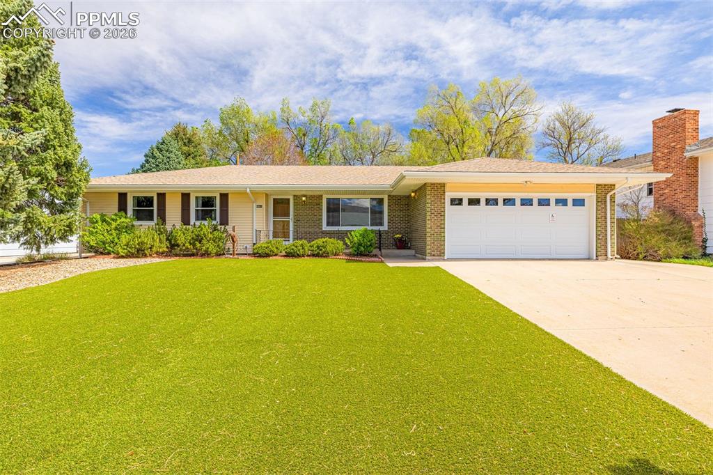 Caption: Front yard is artificial grass for year round curb appeal