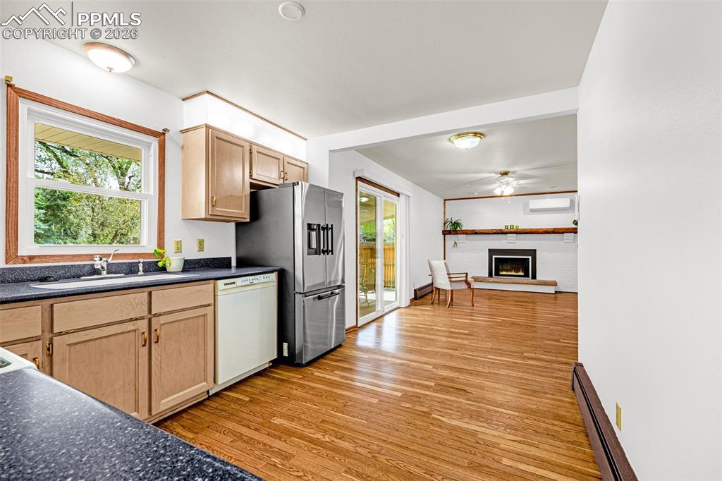 Image 11 of 44: View of of the living room from the kitchen with walk-out 