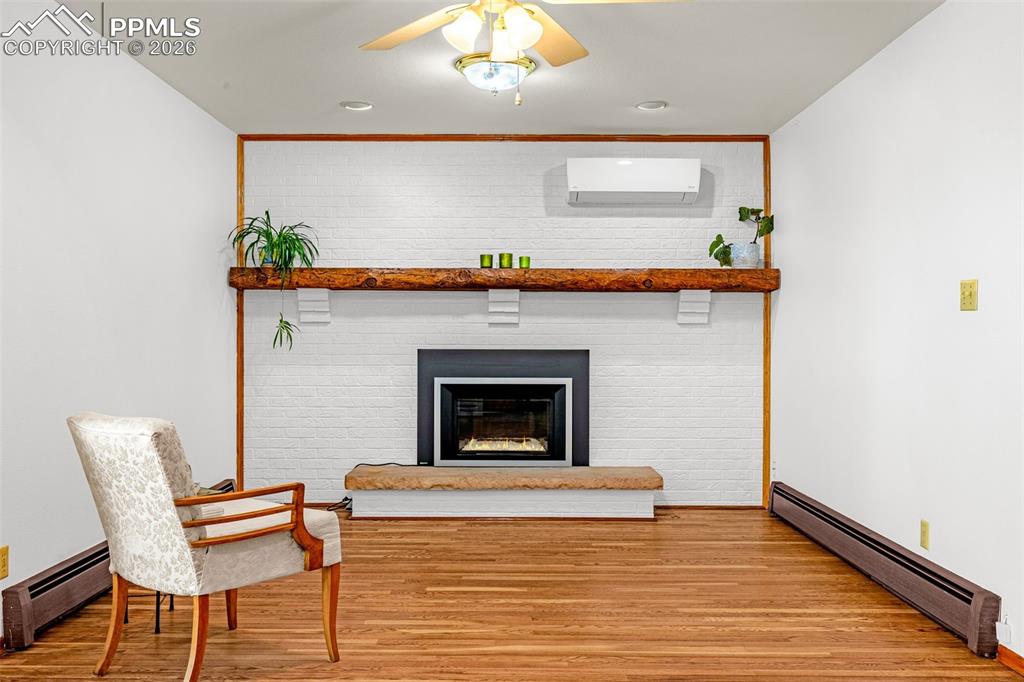 Image 12 of 44: Living room with modern gas fireplace