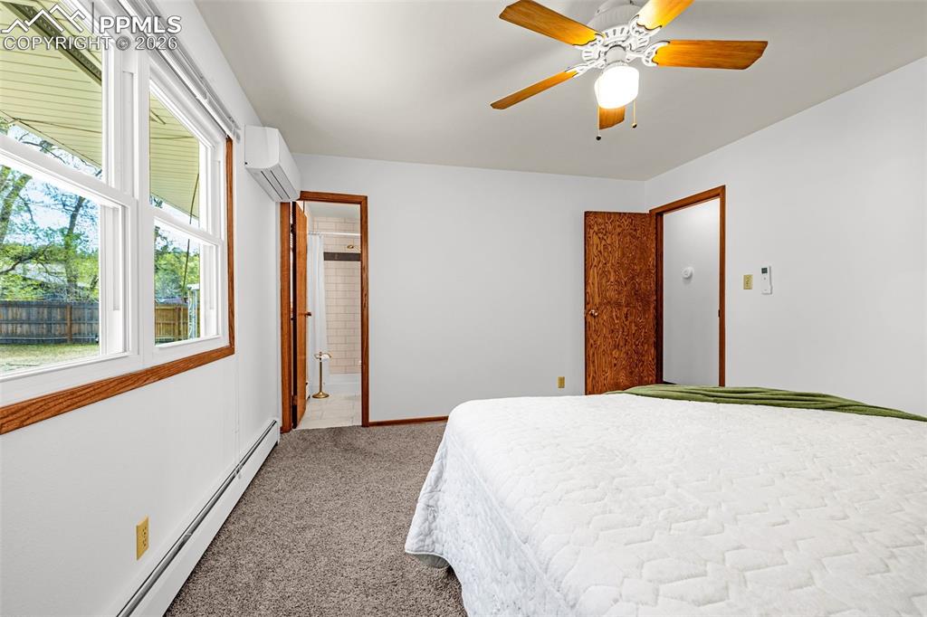 Image 15 of 44: Primary bedroom with bath adjoins