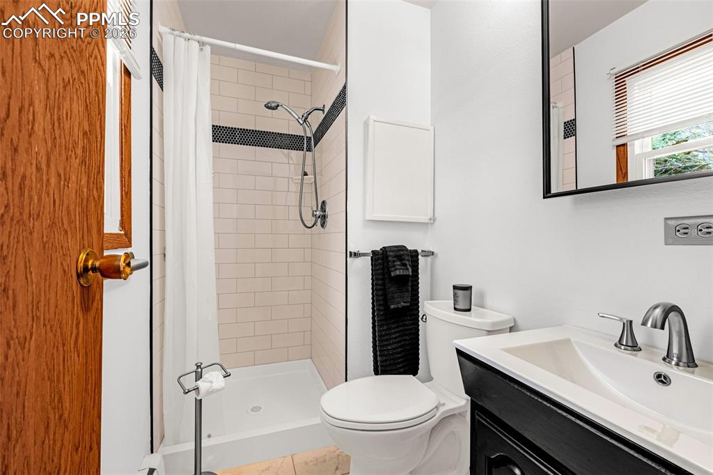 Image 16 of 44: Primary Bathroom with a walk-in shower, toilet and vanity