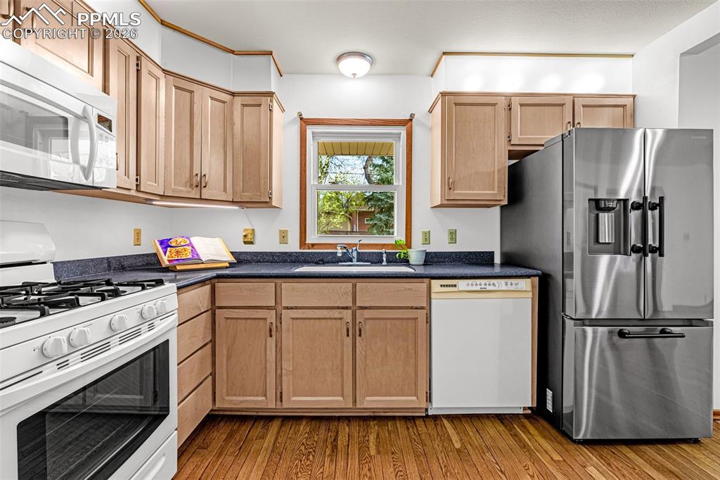 Image 2 of 44: Well-appointed kitchen featuring a gas range