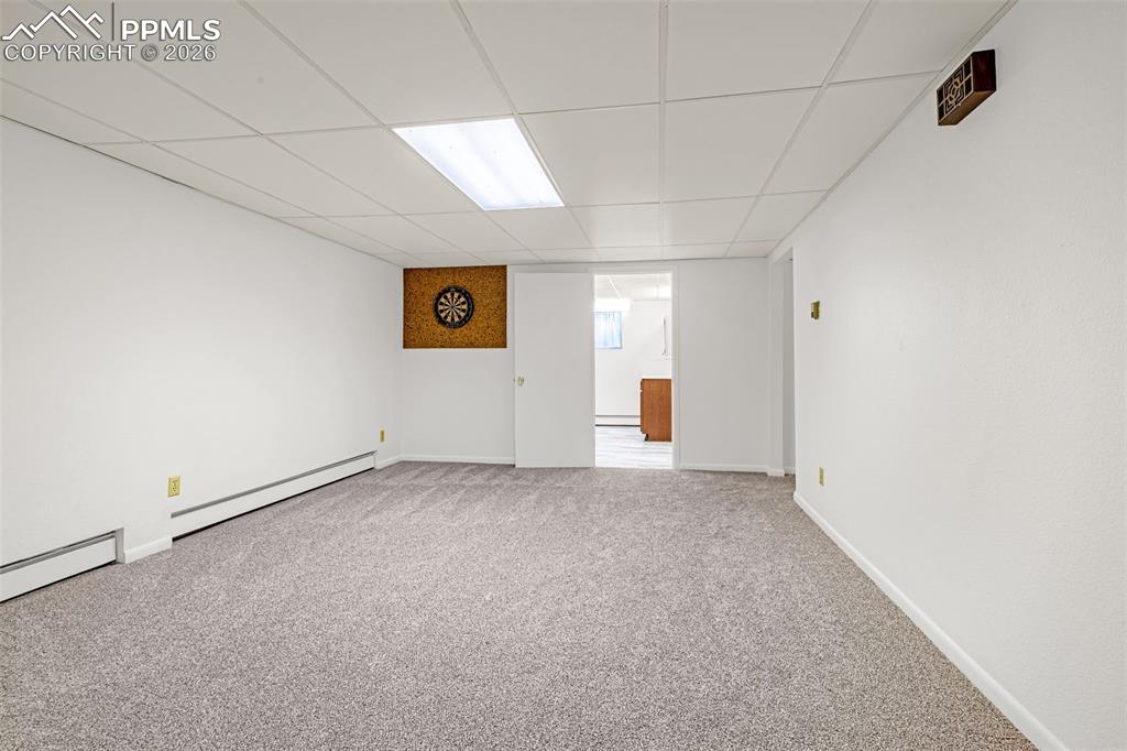 Image 22 of 44: Spacious carpeted basement family room