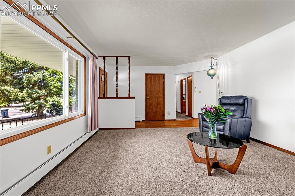 Image 7 of 44: Living room in front of the home