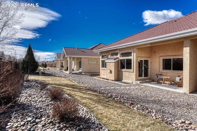 Image 28 of 41: Green space off of the back patio for your pet!