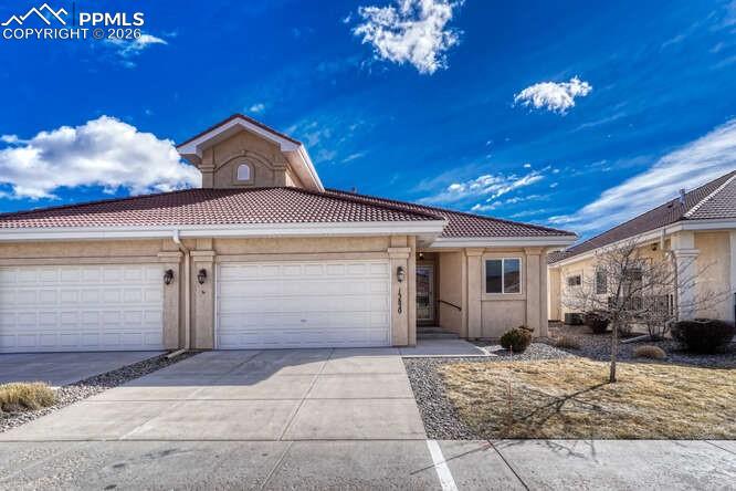 Image 37 of 41: Front of Patio home with a 2 car oversized garage.