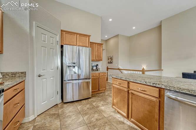 Image 5 of 41: Stainless steel appliances and a Large walk-in pantry.