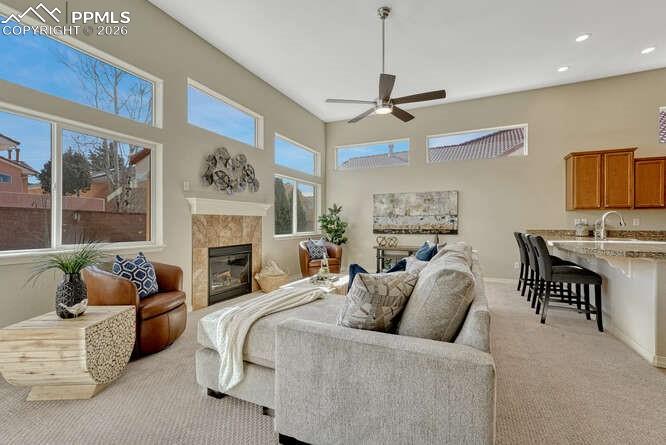 Image 8 of 41: An abundance of windows creates a light and cozy living room.