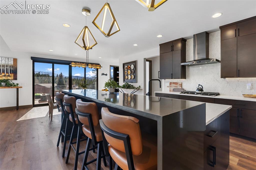 Image 10 of 48: High end finishes and cascading waterfall countertop for a stylish accent!