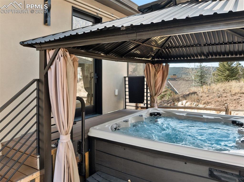 Image 21 of 48: Walk out from primary suite to the hot tub!