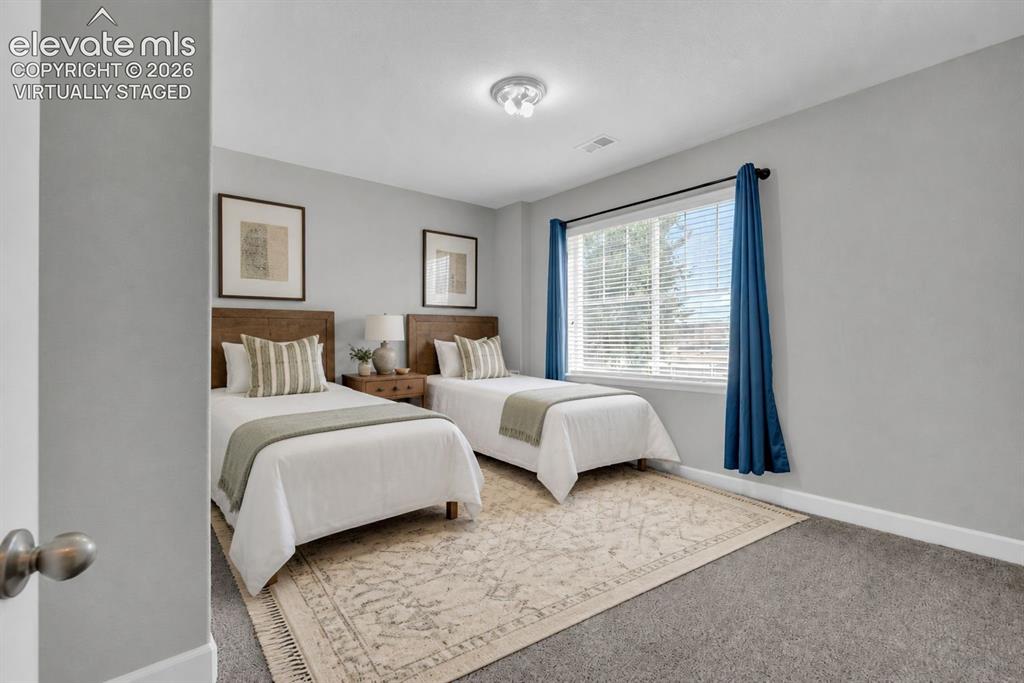 Image 37 of 49: Virtually staged. Basement bedroom. 