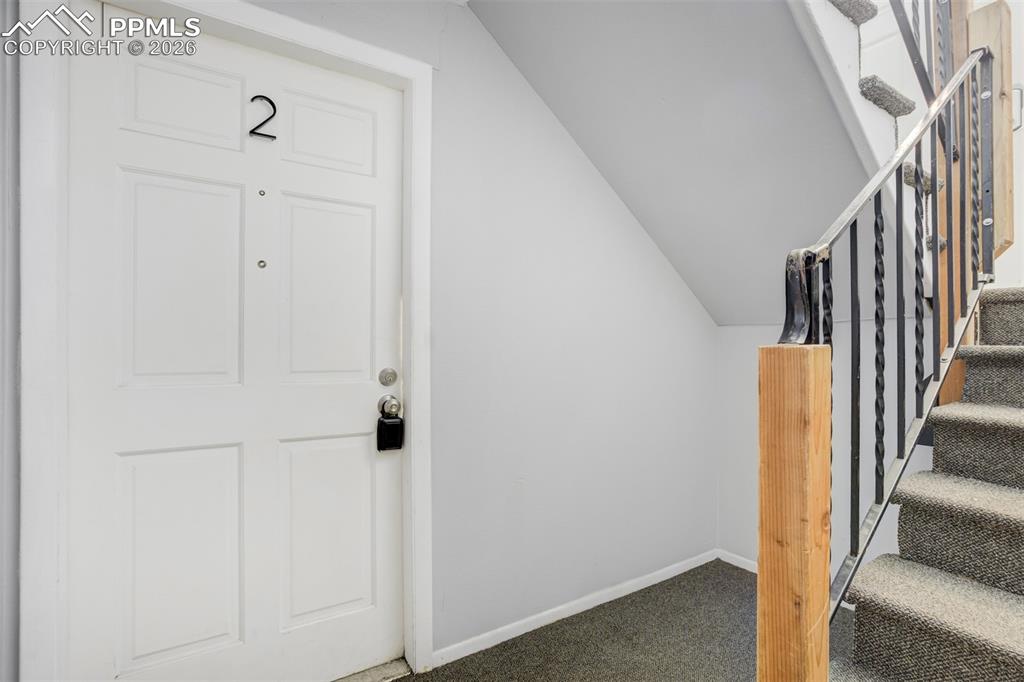Image 4 of 42: Staircase featuring carpet flooring and baseboards