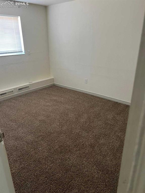 Image 13 of 13: Empty room featuring carpet floors and baseboards