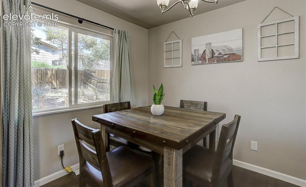 Image 4 of 17: Wood-finish flooring with neutral wall tones