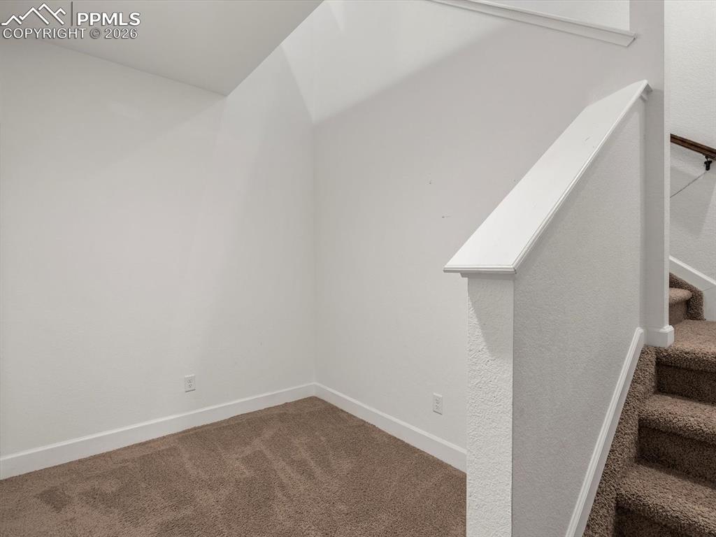 Image 23 of 45: This property features carpeted flooring and white walls, offering a neutra