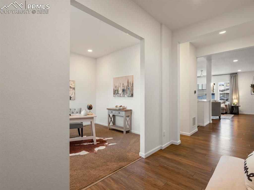 Image 5 of 45: The property features a room with recessed lighting and a carpeted floor, a