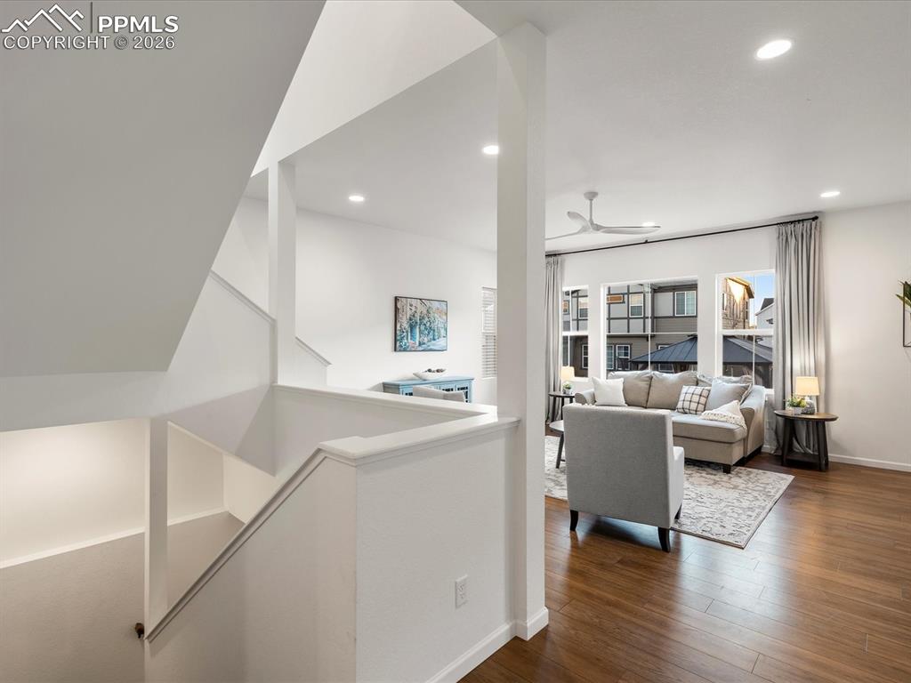 Image 8 of 45: The property features hardwood floors, recessed lighting, and a modern ceil