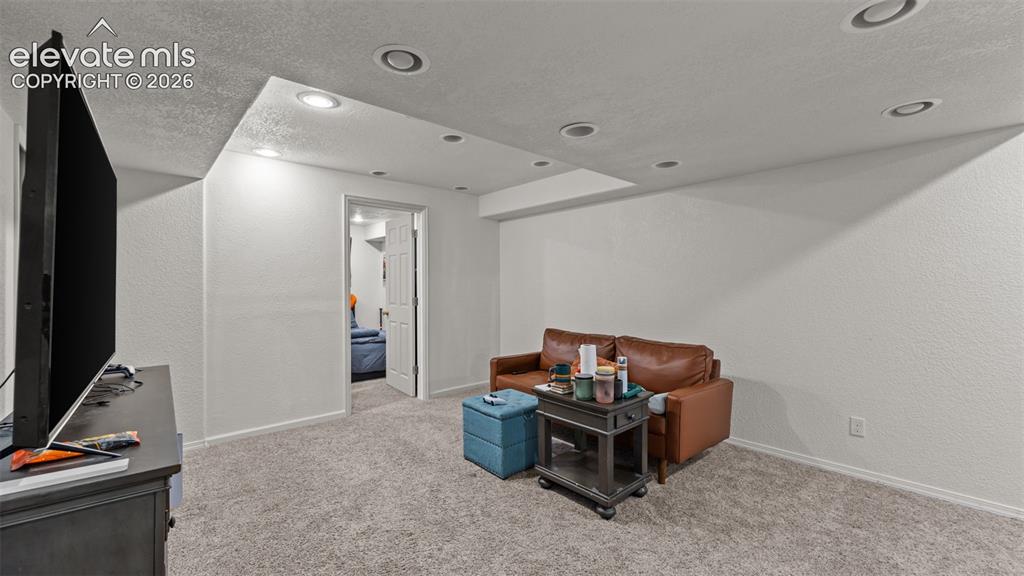 Image 16 of 34: Recessed lighting, light-toned walls, and carpet flooring