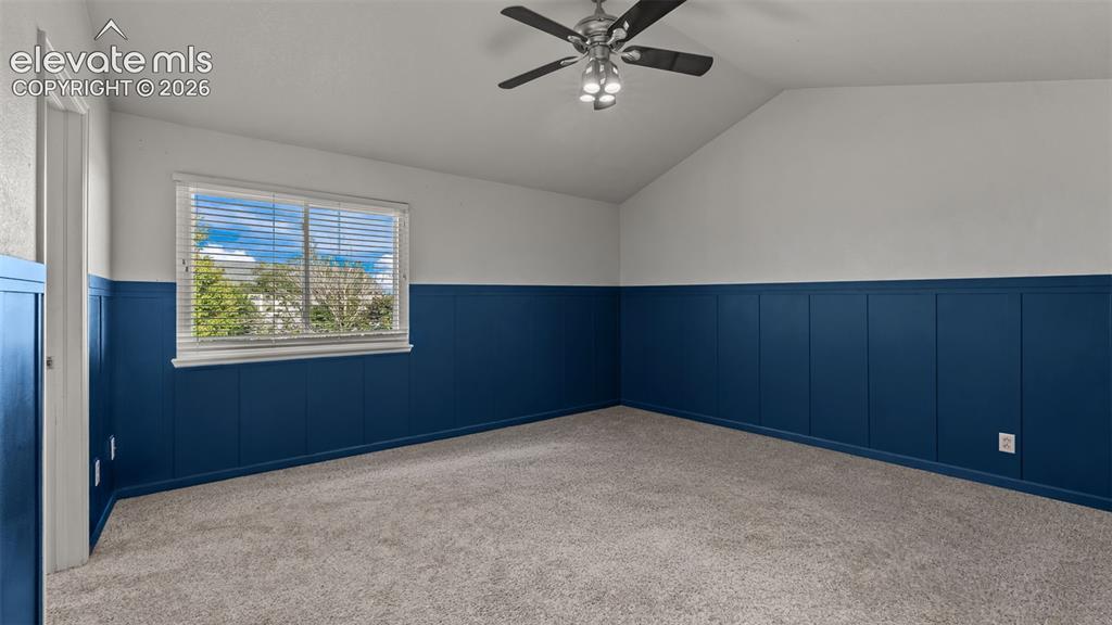 Image 18 of 34: Vaulted ceiling with an attached ceiling fan