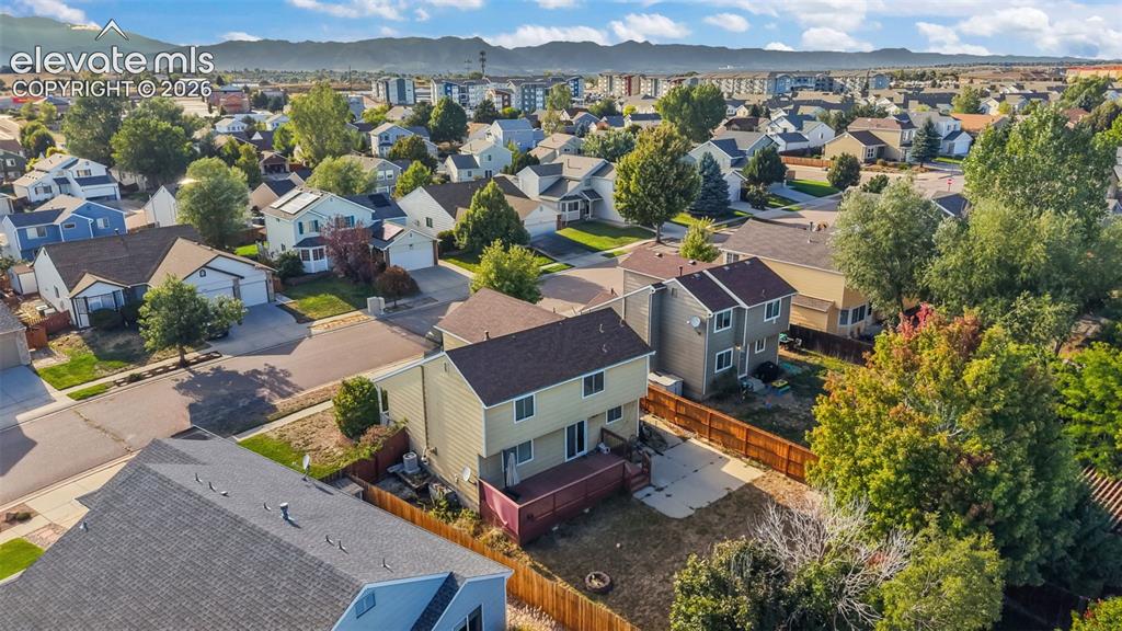Image 33 of 34: Residential neighborhood with varied architectural styles and mature trees
