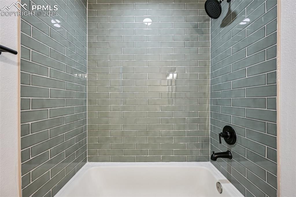 Image 17 of 49: Full bathroom with shower / tub combination