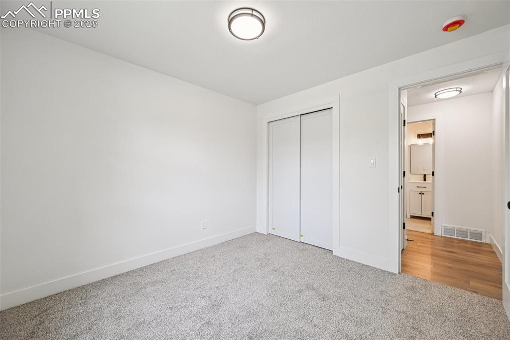 Image 27 of 49: Unfurnished bedroom featuring carpet and a closet