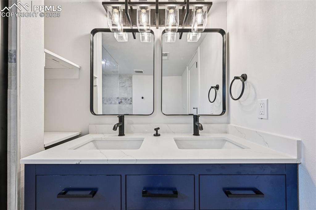 Image 34 of 49: Full bath with double vanity