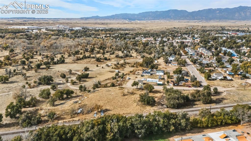 Image 8 of 19: Aerial view of property and surrounding area with mountains
