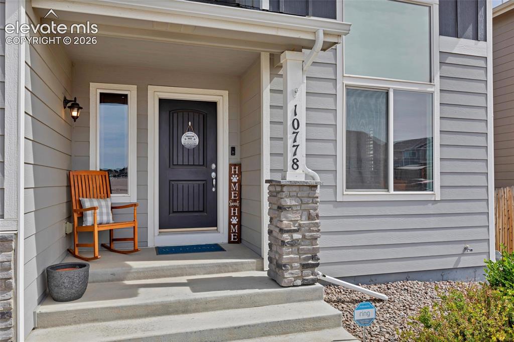 Image 2 of 38: Inviting front porch entrance