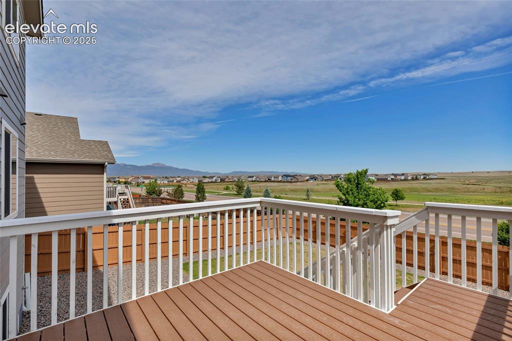 Image 35 of 38: Multi-level composite deck featuring white