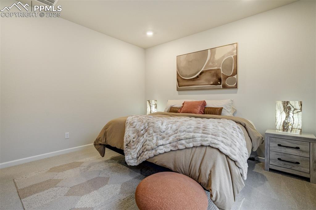 Image 20 of 50: Carpeted bedroom featuring baseboards and recessed lighting