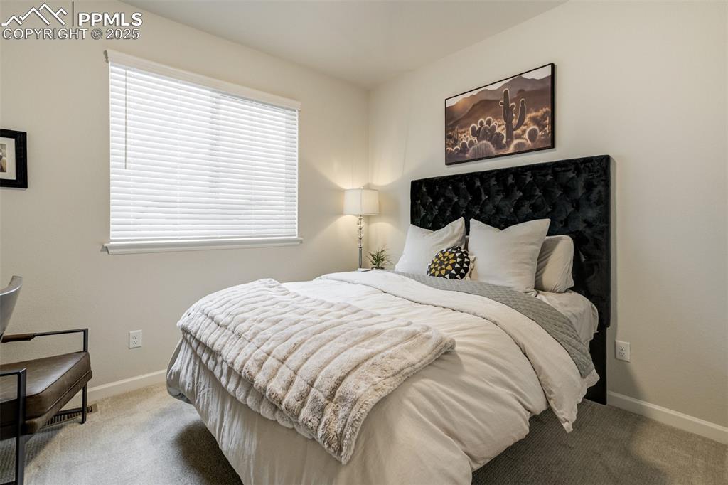 Image 26 of 50: Bedroom with carpet flooring and baseboards