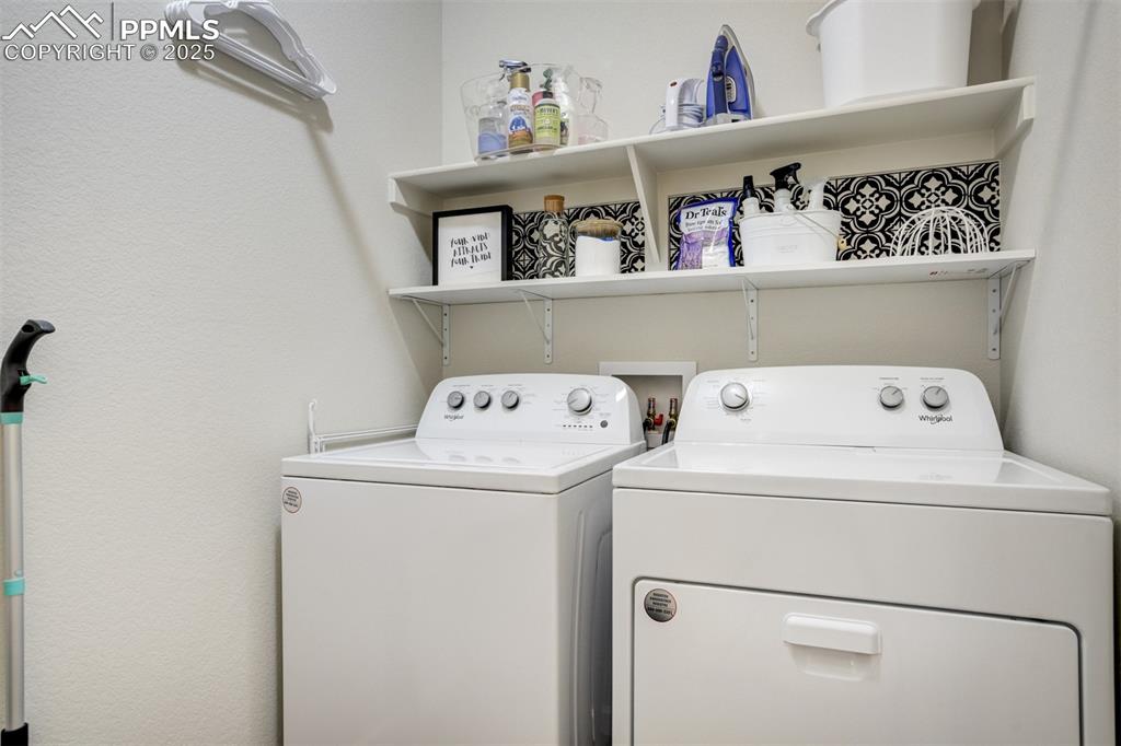 Image 31 of 50: Laundry room with washer and dryer