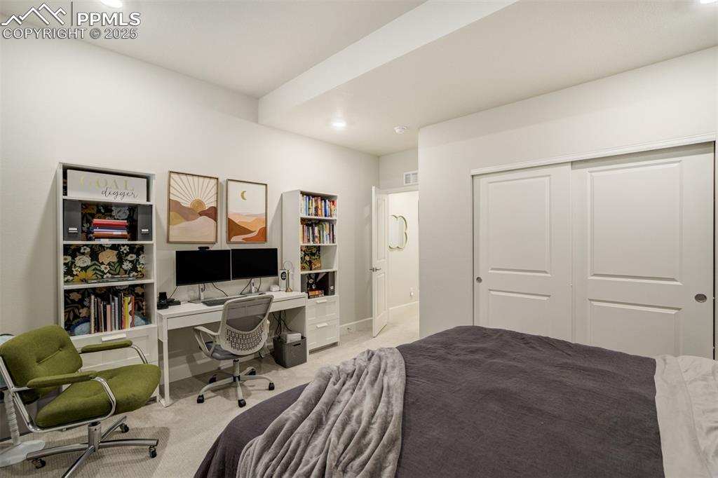 Image 38 of 50: Bedroom featuring carpet, a closet, recessed lighting, and an office area