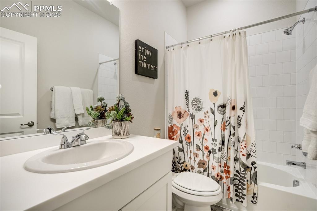Image 39 of 50: Full bath with vanity and shower / bath combination with curtain