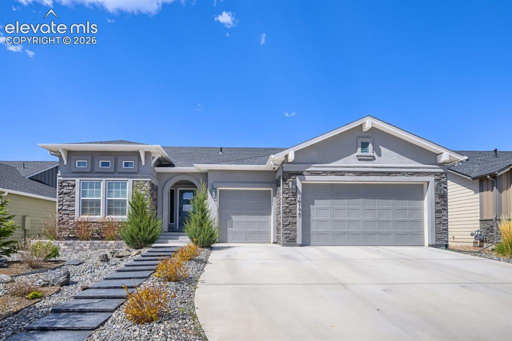 Image 1 of 38: Gorgeous exterior with stone and stucco siding.