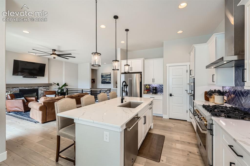 Image 12 of 38: Stunning kitchen opens too the great room.