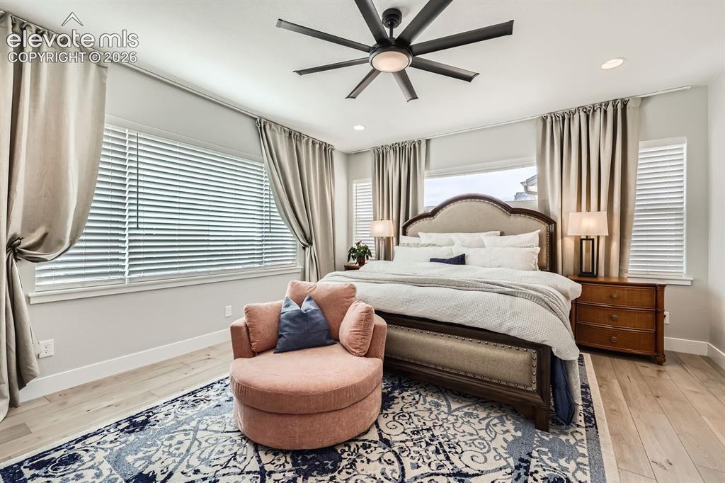 Image 15 of 38: Spacious primary bedroom with a sitting area.