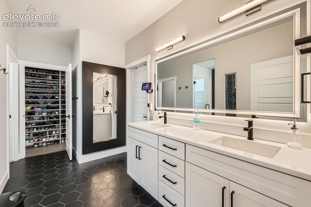Image 18 of 38: Gorgeous tile flooring.  Beautiful frameless walk in shower.