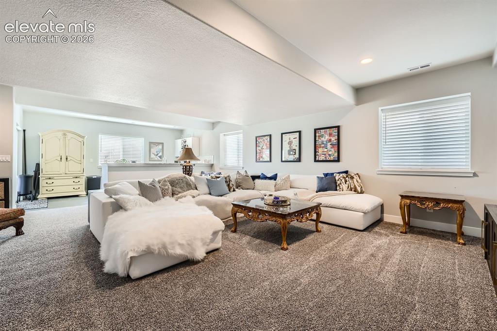 Image 23 of 38: Lower level family room.