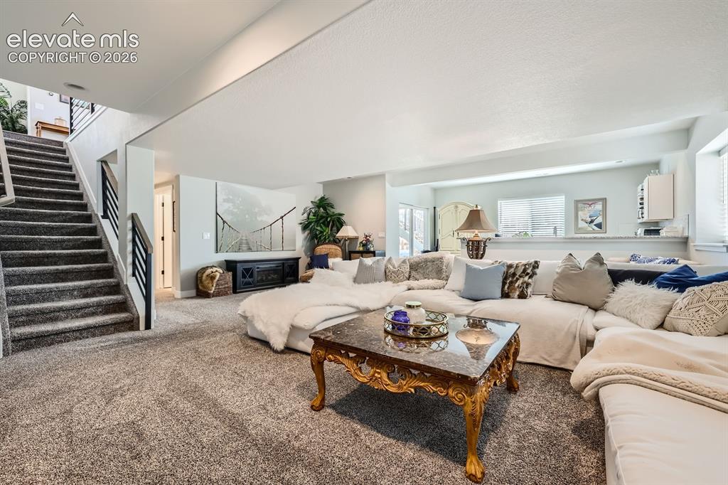 Image 24 of 38: Large lower level family room.