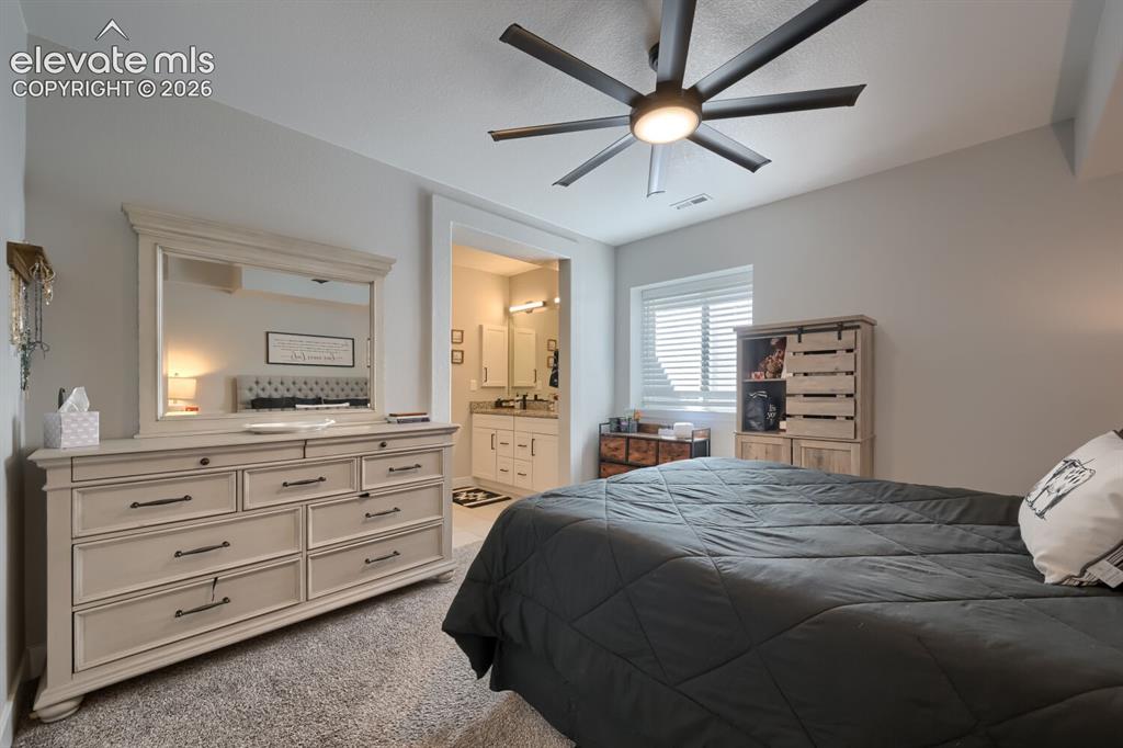 Image 29 of 38: Fifth bedroom is an en suite with an adjoining bath and two walk in closets