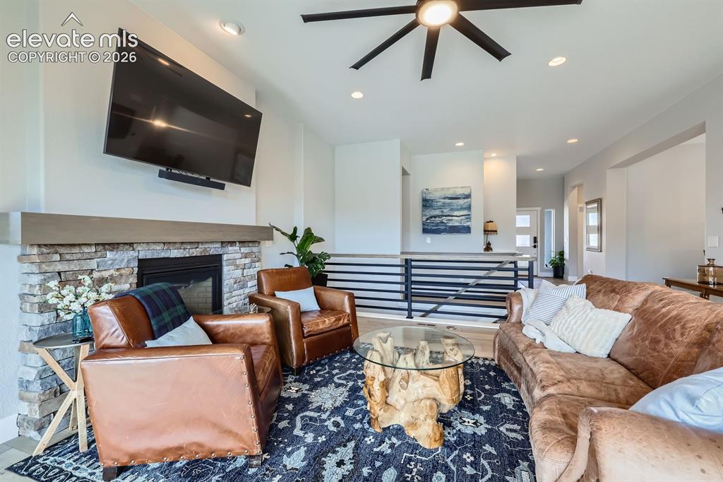 Image 5 of 38: Another view of the living room with versatile furniture placement.