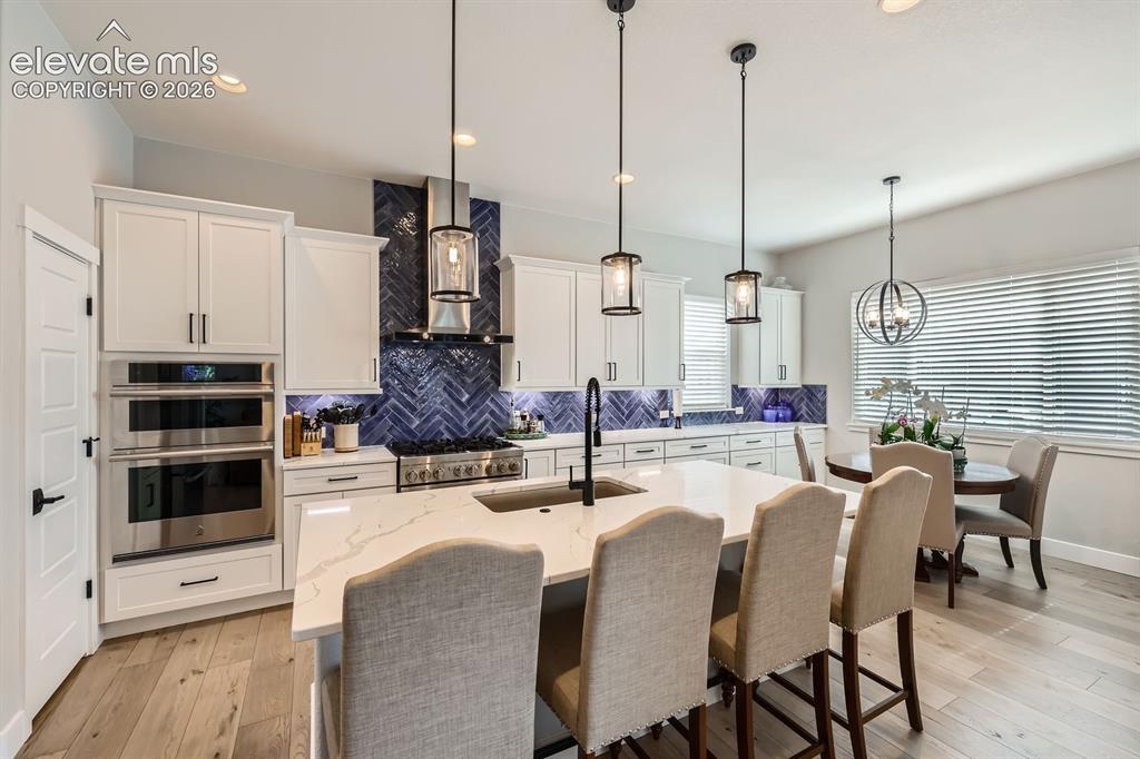 Image 8 of 38: Large kitchen island.  Jenn Air Appliances.